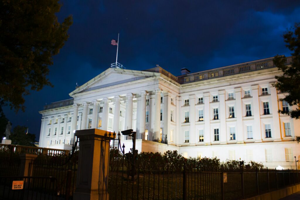 Stunning view of the U.S. Treasury Building illuminated against a twilight sky in Washington, DC.
